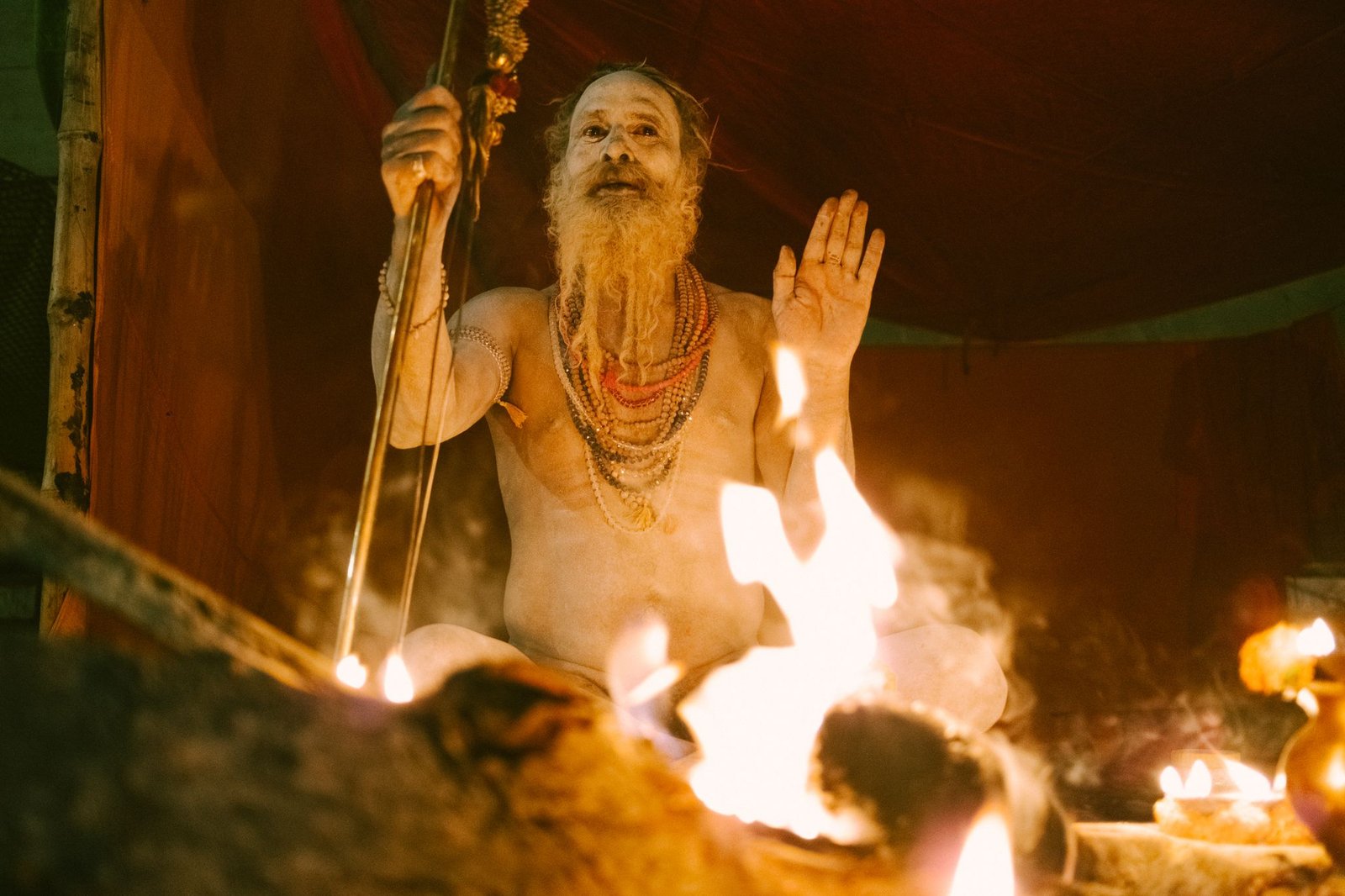 Ritual fire and ascetic presence near the cremation ground in Varanasi