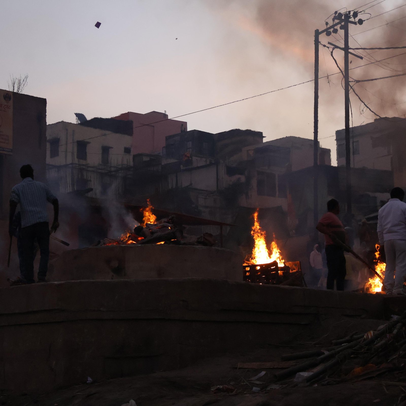Smoke and active pyres at Harishchandra Ghat in Varanasi